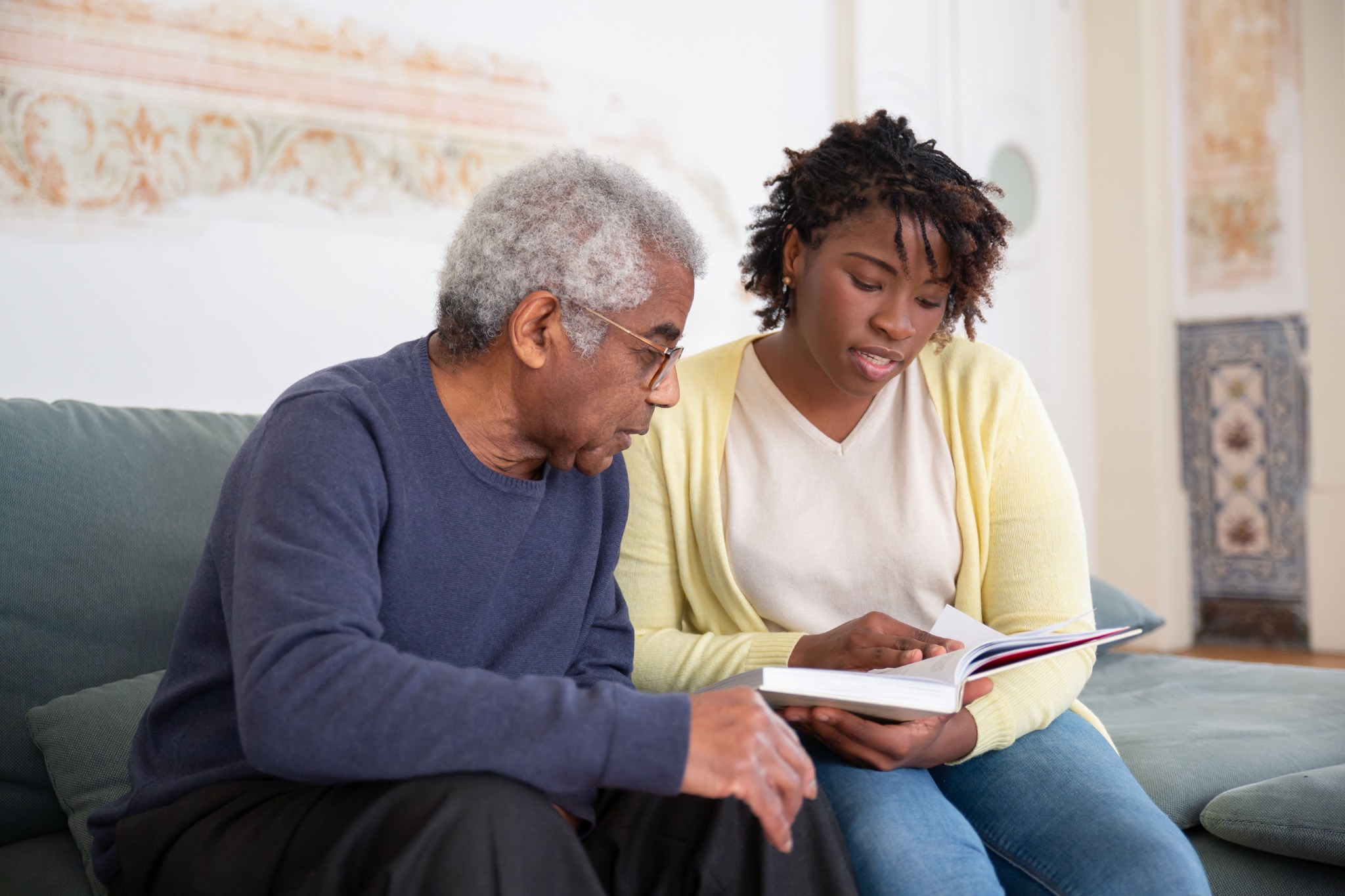 Caregiver and older adult spending time together at home